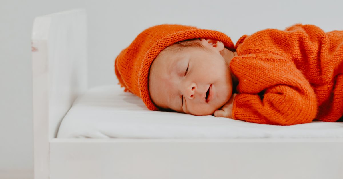 Baby sleeping safely in a crib during the bassinet to crib transition