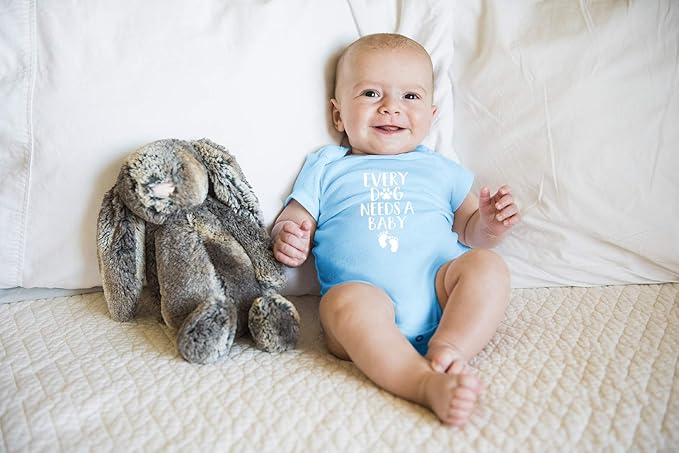 Every Dog Needs a Baby - Funny Baby Essentials Bodysuit - Baby Boy Clothes Newborn Girl Outfits