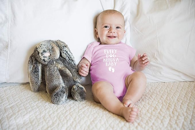 Every Dog Needs a Baby - Funny Baby Essentials Bodysuit - Baby Boy Clothes Newborn Girl Outfits