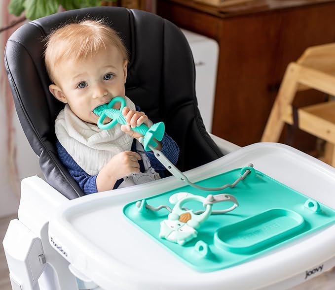 Busy Baby Gift Set - Silicone Placemat with Suction Cups, Bottle Bungee, Teething Spoon and 4 Universal Straps, Keeps Baby Essentials Like Bottles Within Reach & Off The Floor (Spearmint)